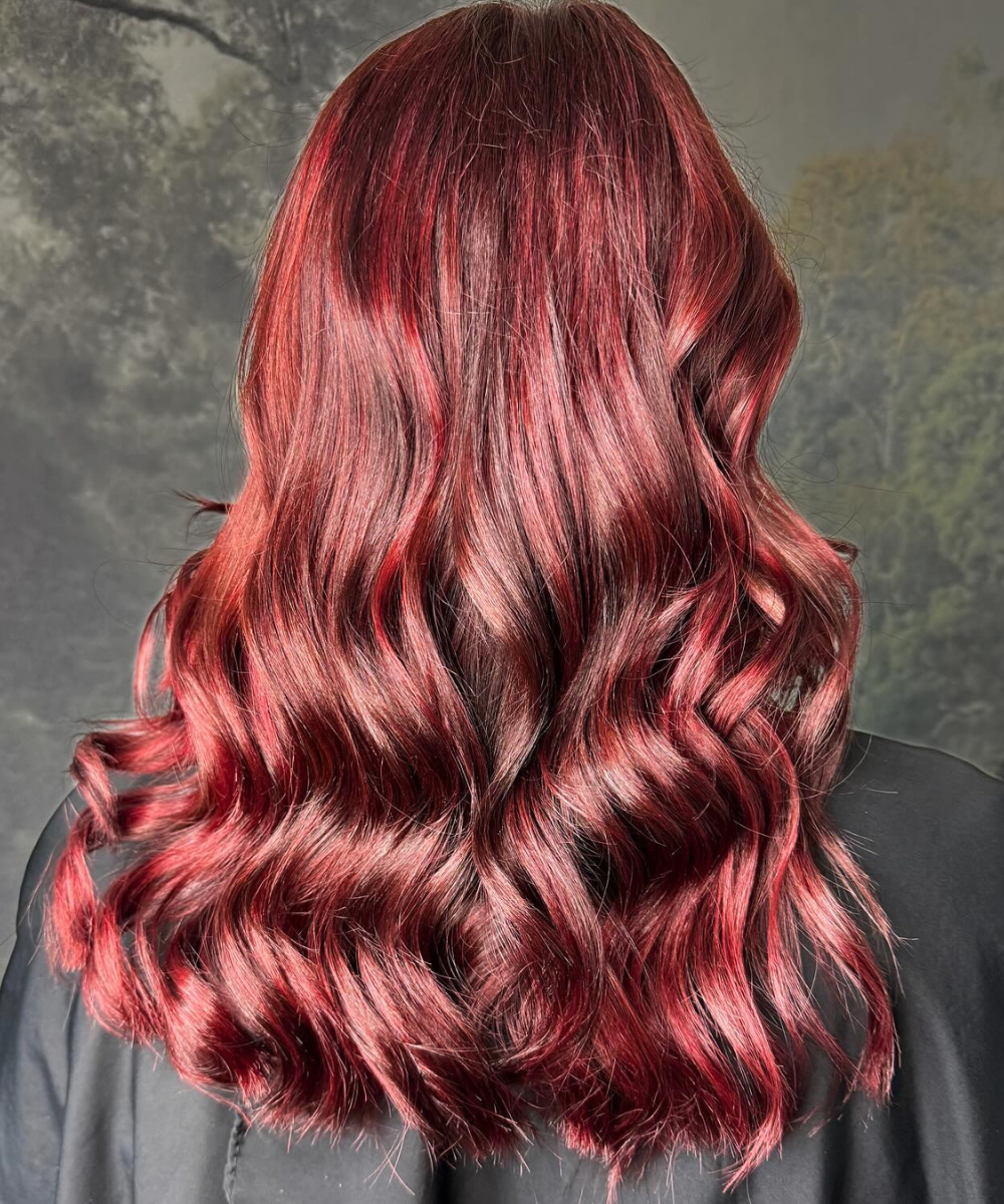Rich ruby red hair colour with glossy waves